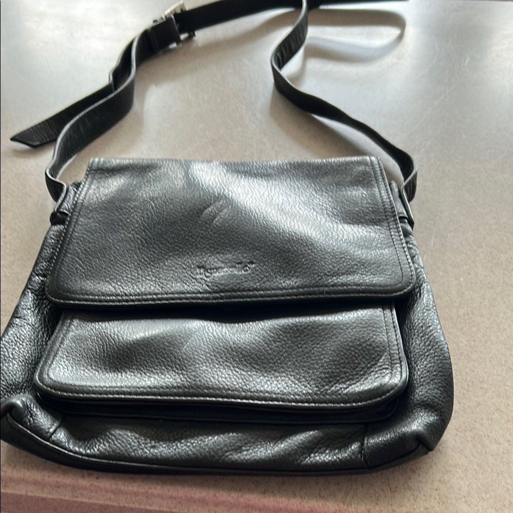 Tignanello Black Messenger Bag with Adjustable Strap and Flap-Over Design